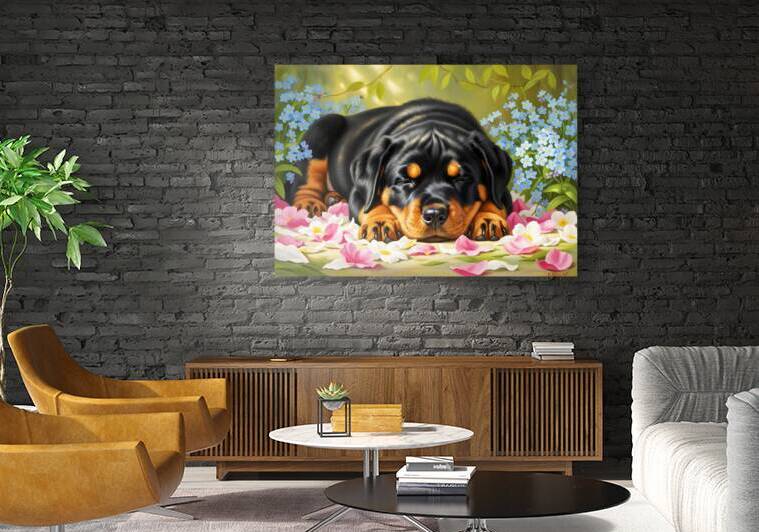 Sleepy Rottweiler Puppy Rests In Flower Bed by Puppy Prints